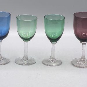 A set of four antique coloured wine glasses in blue, green and amethyst, from Antiques Arena's real stock
