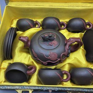A Yixing-style purple clay teapot set with a dragon motif, boxed, from Antiques Arena's real stock